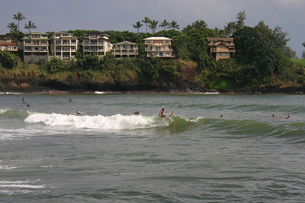 Surfers in front of Kauai Marriott Resort