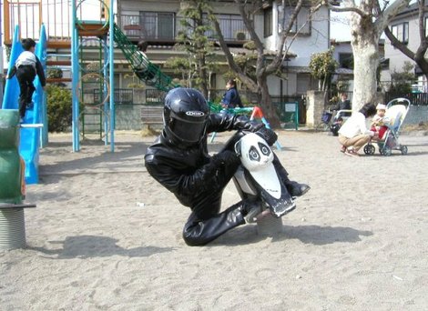 Motorcycle cornering on a playground spring 